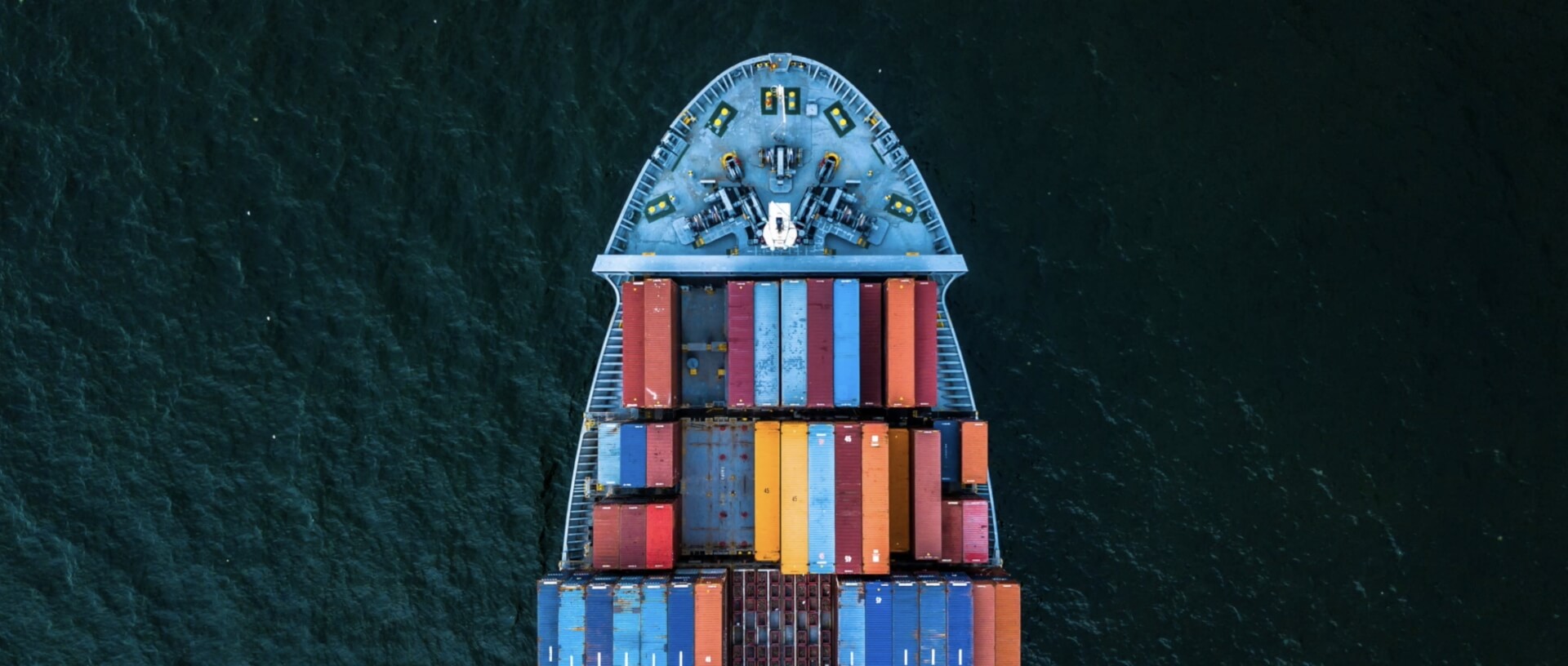 Looking down photo of a container ship bow