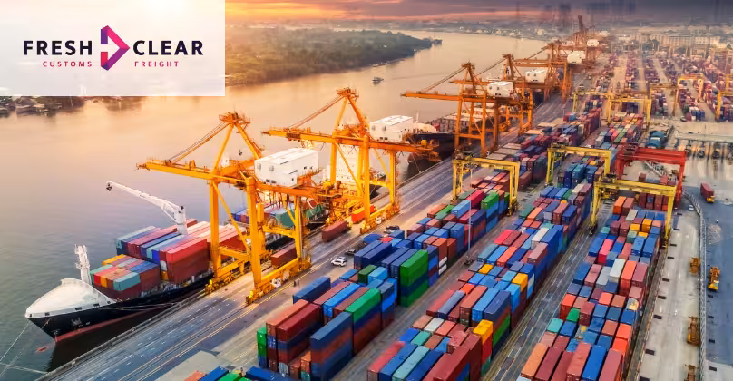 Arial view of a large docks with ships and containers.